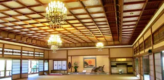 An ornate wooden ceiling of a traditional Japanese building.