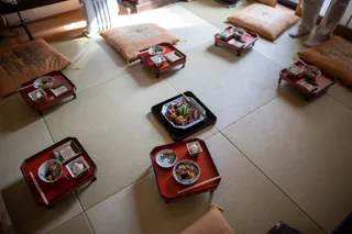 Woven tatami mats covering the floor of a traditional Japanese room.