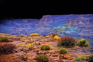 Grand Canyon rendered as a lidar point cloud, canyon walls and floor emerging from fog.
